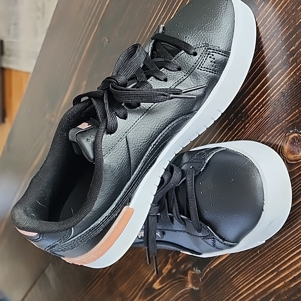 Black leather with copper color detail Puma sneakers, like new!